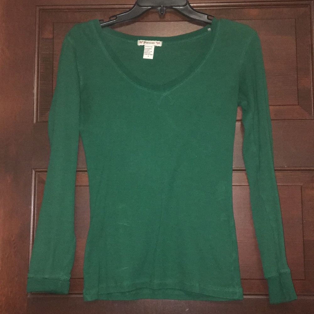 Green V-neck shirt